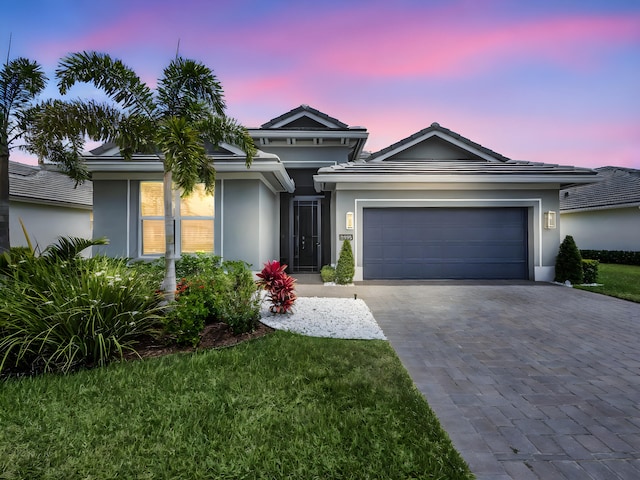 12495 SW Sunrise Lake Ter, Port Saint Lucie, FL 34987 - single story home featuring decorative driveway, an attached garage, and stucco siding