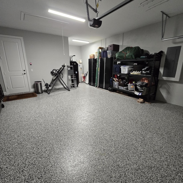 12495 SW Sunrise Lake Ter, Port Saint Lucie, FL 34987 - garage featuring a garage door opener and electric panel