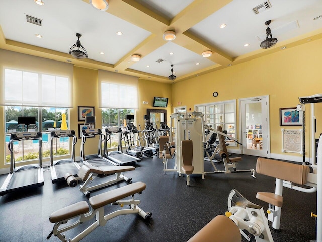 12495 SW Sunrise Lake Ter, Port Saint Lucie, FL 34987 - gym featuring a towering ceiling, coffered ceiling, beam ceiling, recessed lighting, and baseboards