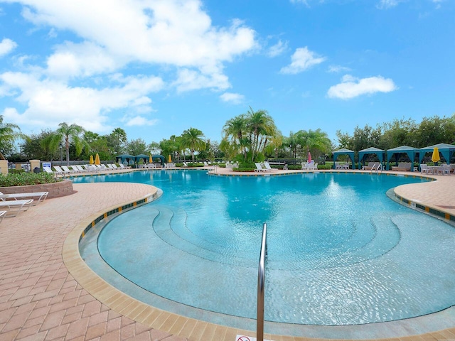 12495 SW Sunrise Lake Ter, Port Saint Lucie, FL 34987 - community pool with a patio