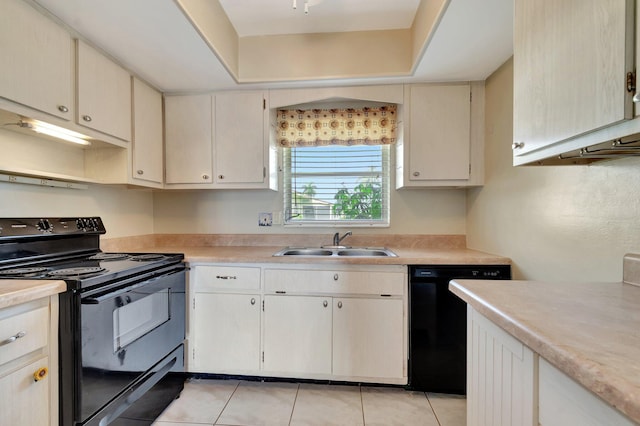 2811 Ashley Dr E Unit E, West Palm Beach, FL 33415 - kitchen with light countertops, light tile patterned floors, a sink, and black appliances