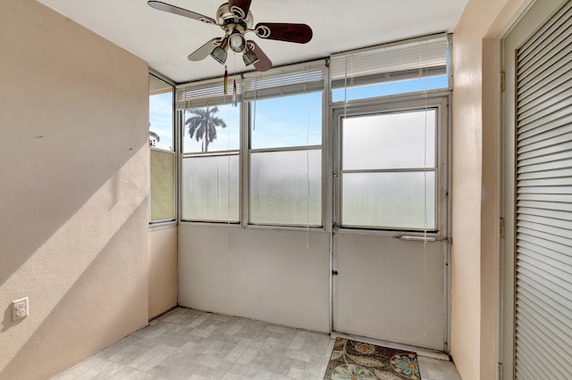 2811 Ashley Dr E Unit E, West Palm Beach, FL 33415 - unfurnished sunroom with a ceiling fan