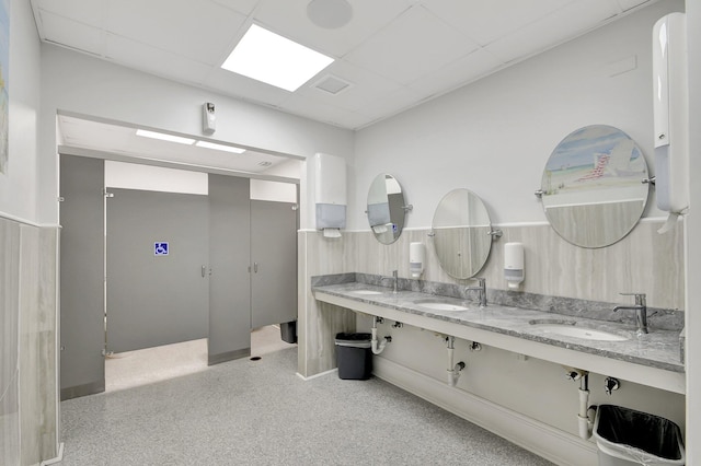 2811 Ashley Dr E Unit E, West Palm Beach, FL 33415 - bathroom featuring double vanity, a sink, a paneled ceiling, and carpet flooring