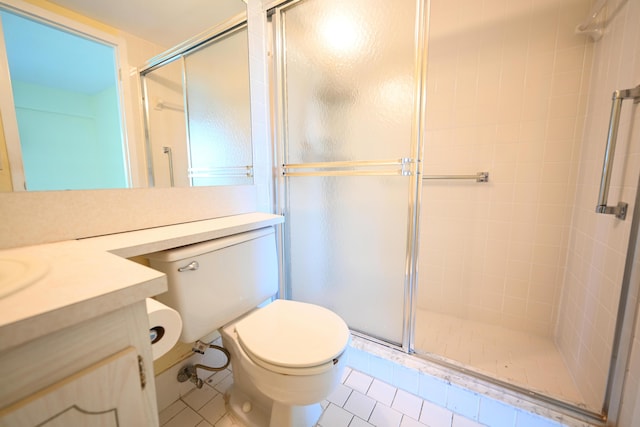 205 Mansfield E, Boca Raton, FL 33434 - full bathroom with vanity, tile patterned flooring, a shower stall, and toilet