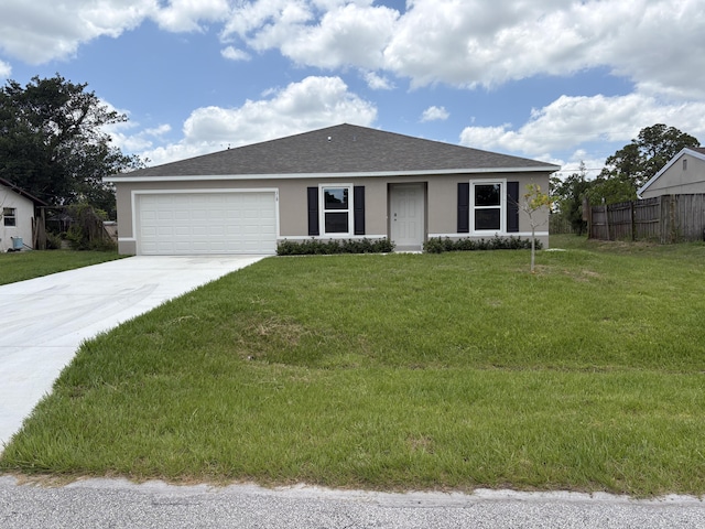 318 SE Dalva Ave, Port Saint Lucie, FL 34984 - single story home featuring stucco siding, concrete driveway, an attached garage, and a shingled roof