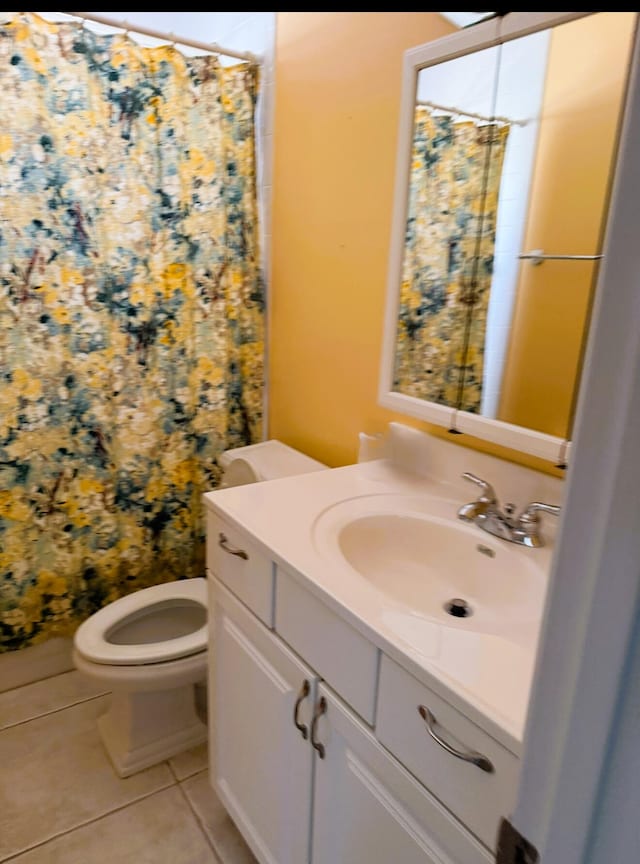 full bath featuring vanity, tile patterned flooring, a shower with curtain, and toilet