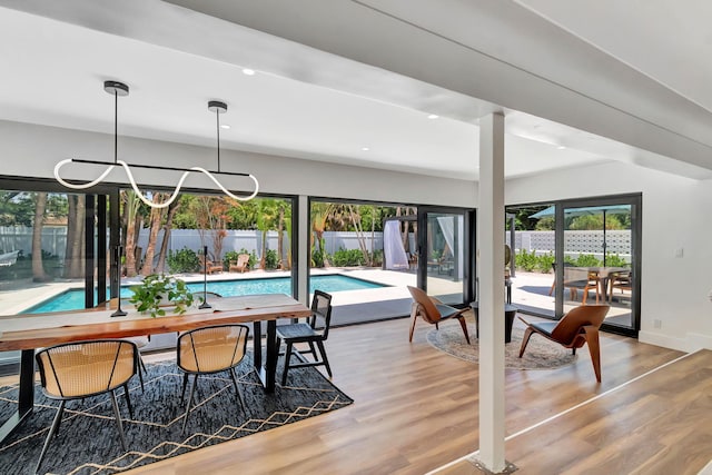 dining area featuring recessed lighting, baseboards, and wood finished floors