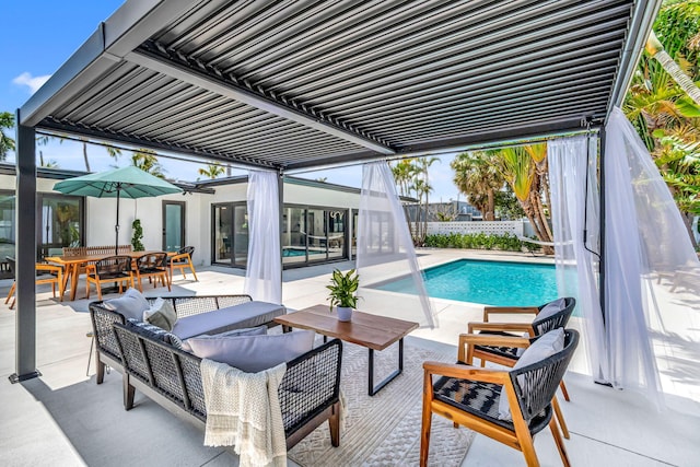 view of pool featuring a patio, outdoor lounge area, outdoor dining area, and a fenced in pool