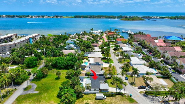 birds eye view of property featuring a water view and a residential view