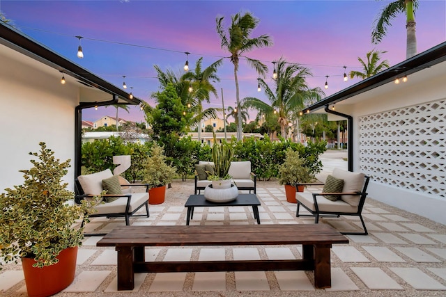 view of patio terrace at dusk