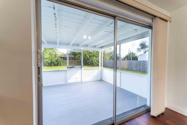 2607 Wiley St, Hollywood, FL 33020 - doorway to outside featuring beam ceiling and dark wood-type flooring