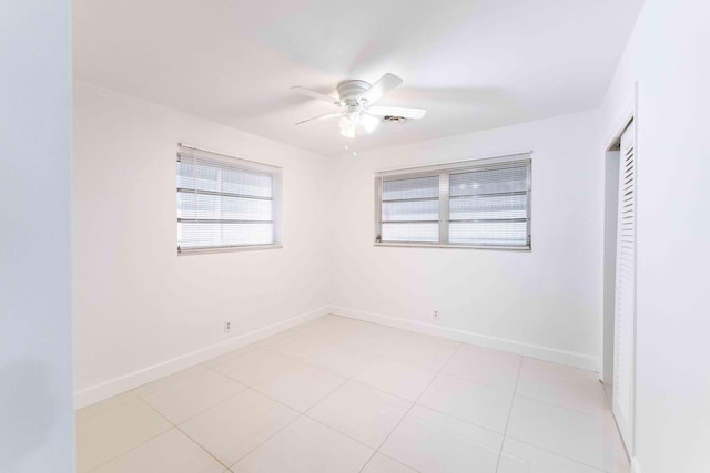 2607 Wiley St, Hollywood, FL 33020 - unfurnished bedroom with light tile patterned floors, baseboards, and ceiling fan