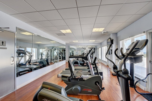 2800 S Ocean Blvd Unit 23C, Boca Raton, FL 33432 - exercise room featuring visible vents, a drop ceiling, and wood finished floors