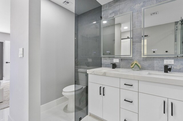 200 SW 12th St, Boca Raton, FL 33432 - full bathroom featuring a sink, toilet, double vanity, and visible vents
