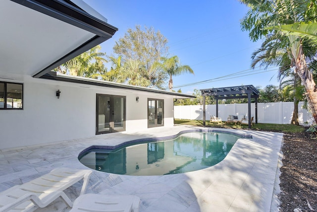 200 SW 12th St, Boca Raton, FL 33432 - view of pool featuring french doors, a fenced in pool, a fenced backyard, a patio, and a pergola