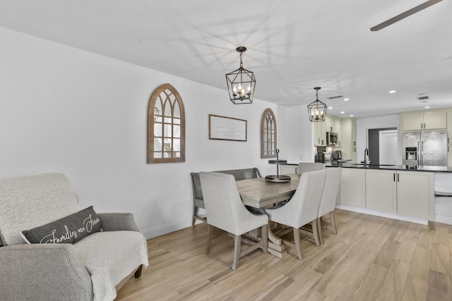 1693 Woodbridge Lakes Cir, West Palm Beach, FL 33406 - dining room featuring a chandelier, light wood-style floors, recessed lighting, and baseboards