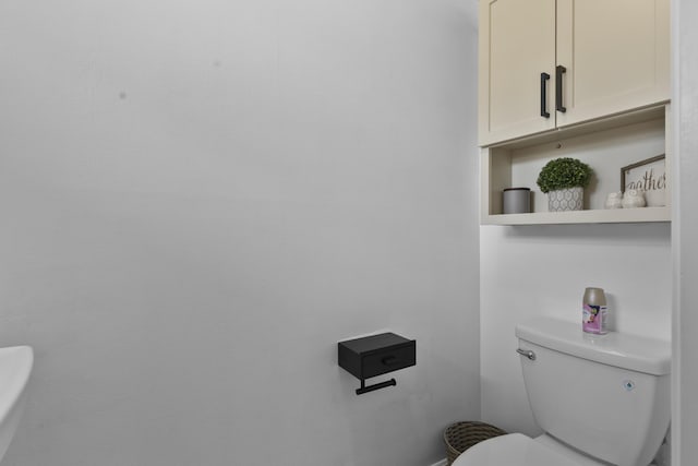 1693 Woodbridge Lakes Cir, West Palm Beach, FL 33406 - bathroom with toilet and baseboards
