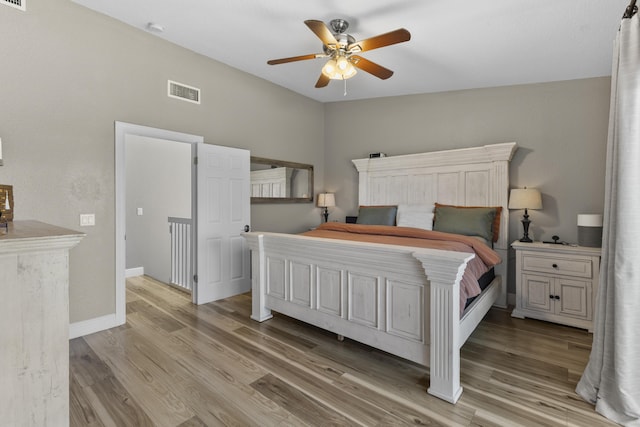 1693 Woodbridge Lakes Cir, West Palm Beach, FL 33406 - bedroom featuring light wood-style flooring, ceiling fan, and baseboards