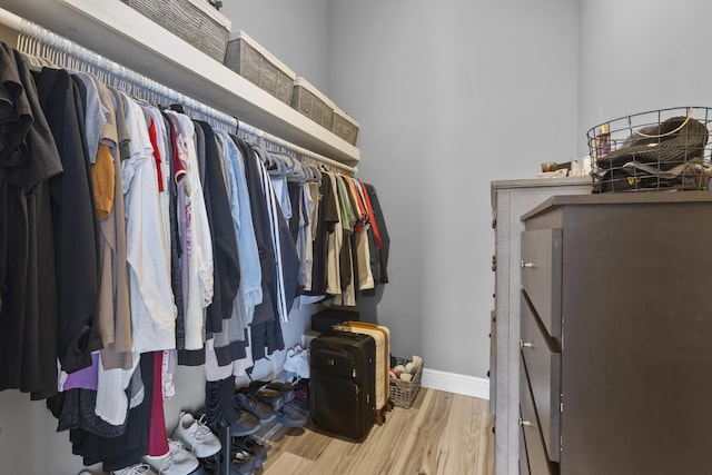 1693 Woodbridge Lakes Cir, West Palm Beach, FL 33406 - walk in closet with wood finished floors