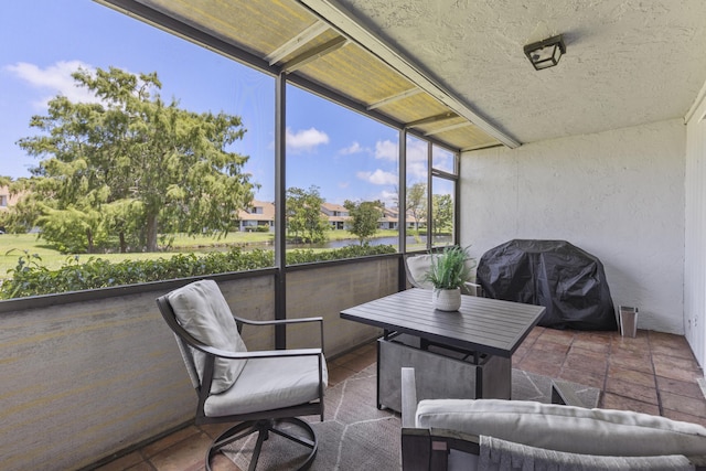 1693 Woodbridge Lakes Cir, West Palm Beach, FL 33406 - sunroom / solarium with a water view