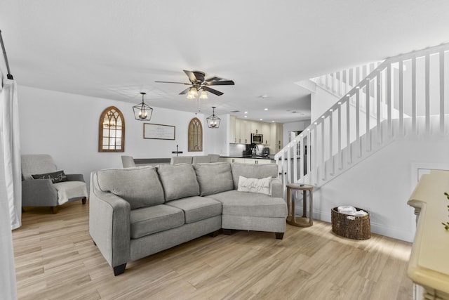 1693 Woodbridge Lakes Cir, West Palm Beach, FL 33406 - living area featuring light wood-type flooring, ceiling fan, stairs, baseboards, and recessed lighting
