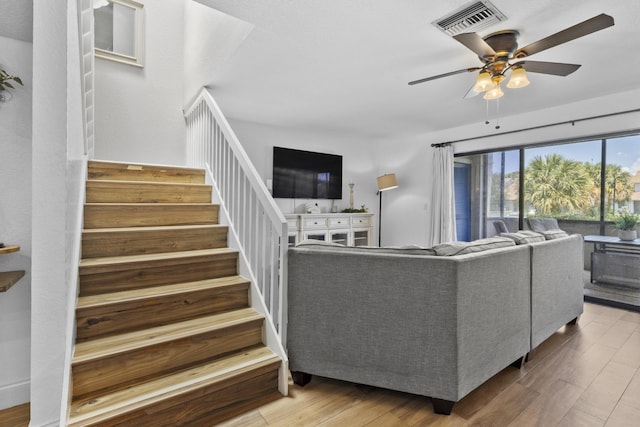 1693 Woodbridge Lakes Cir, West Palm Beach, FL 33406 - living area with ceiling fan, wood finished floors, and stairs