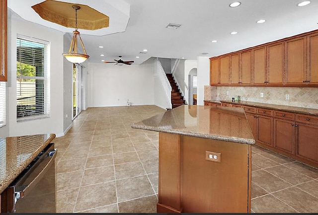 kitchen with visible vents, recessed lighting, and arched walkways