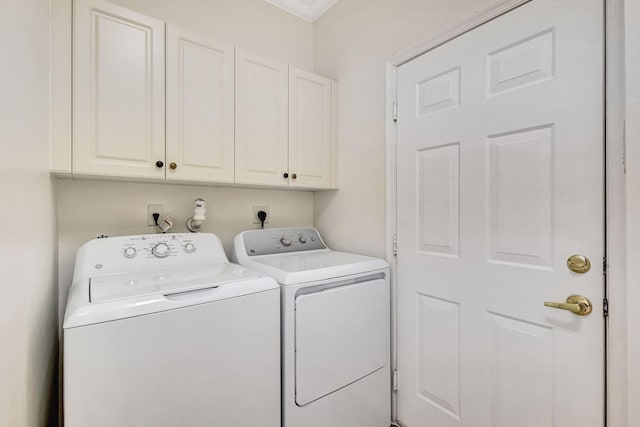 laundry area featuring cabinet space and washing machine and dryer