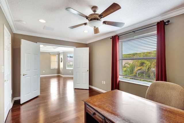 office space with crown molding, dark wood-style flooring, ceiling fan, and baseboards