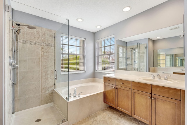 full bath featuring a garden tub, visible vents, a shower stall, vanity, and tile patterned floors