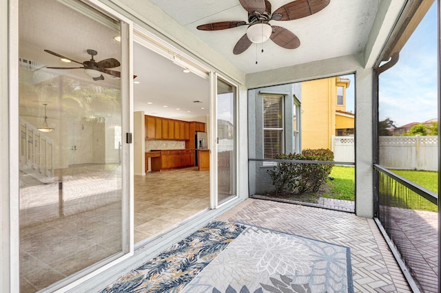 sunroom / solarium featuring ceiling fan and recessed lighting