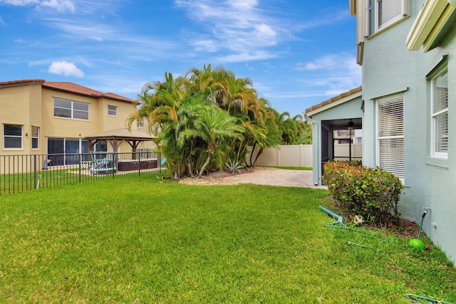 view of yard with a patio, a gazebo, and a fenced backyard