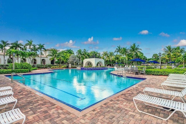 community pool with a patio area