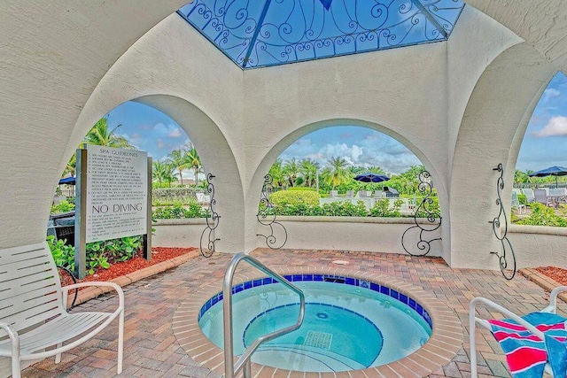 view of pool featuring a community hot tub