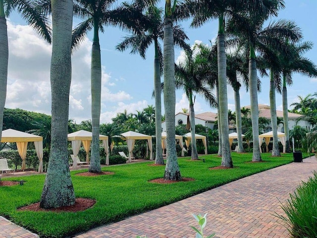 view of property's community featuring a yard and a gazebo