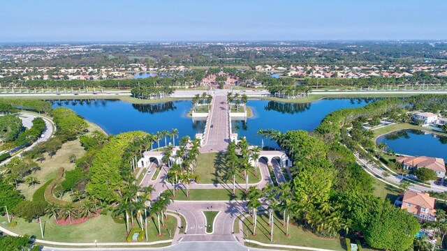 birds eye view of property with a water view and a residential view