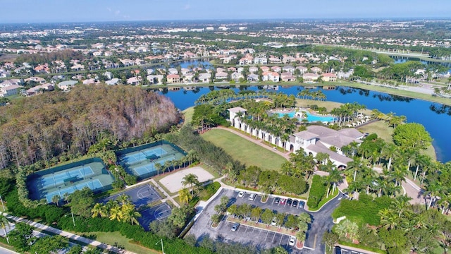 birds eye view of property featuring a water view and a residential view
