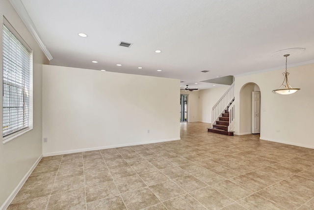 empty room featuring a ceiling fan, arched walkways, baseboards, recessed lighting, and light tile patterned flooring
