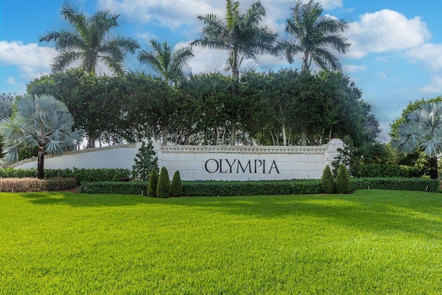 community / neighborhood sign with a lawn