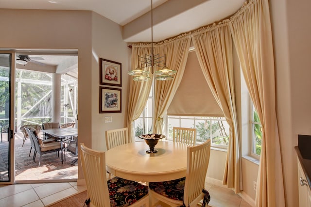 dining area featuring ceiling fan and light tile patterned floors