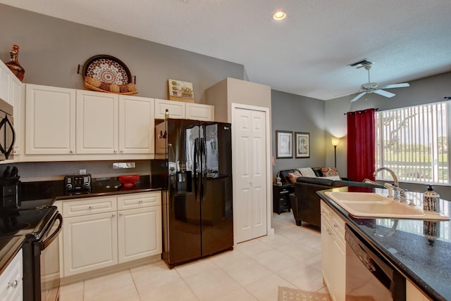 kitchen with ceiling fan, a sink, black appliances, dark countertops, and white cabinets