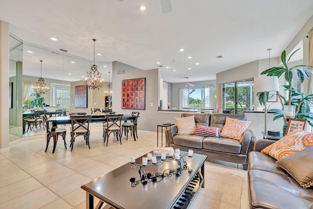 living area featuring a chandelier, light tile patterned floors, and recessed lighting