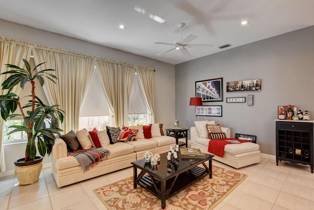 living room featuring a ceiling fan, light tile patterned floors, visible vents, and recessed lighting