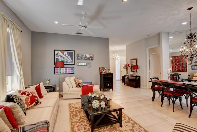 living room with light tile patterned floors, recessed lighting, and ceiling fan with notable chandelier