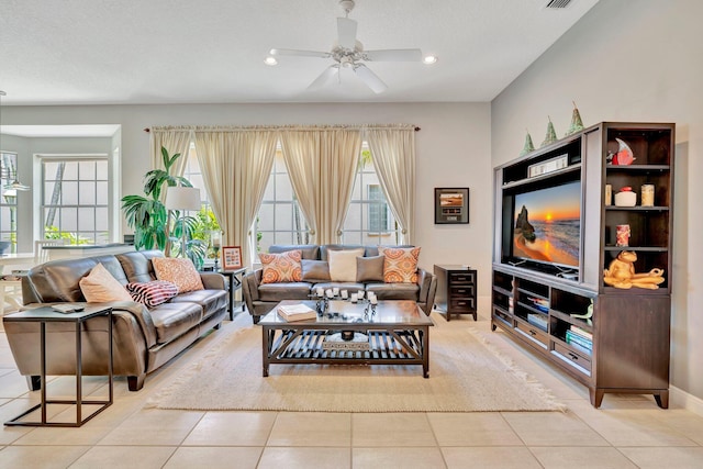 living area with ceiling fan, recessed lighting, and light tile patterned flooring