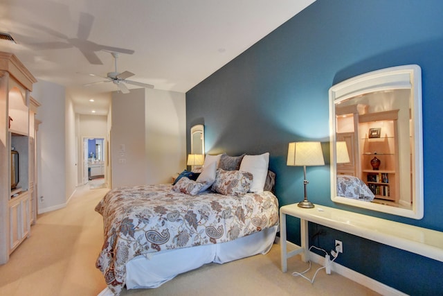 carpeted bedroom featuring visible vents, baseboards, and ceiling fan