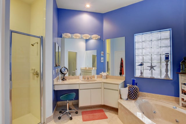 bathroom with vanity, a whirlpool tub, a shower stall, and tile patterned floors