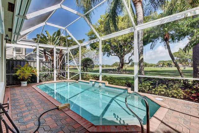 outdoor pool with a patio and a lanai