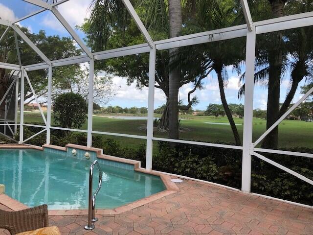 outdoor pool with a patio area and a lanai