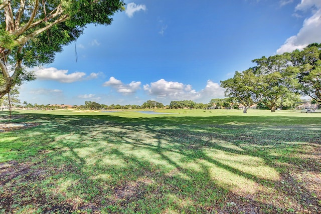 view of yard featuring view of golf course